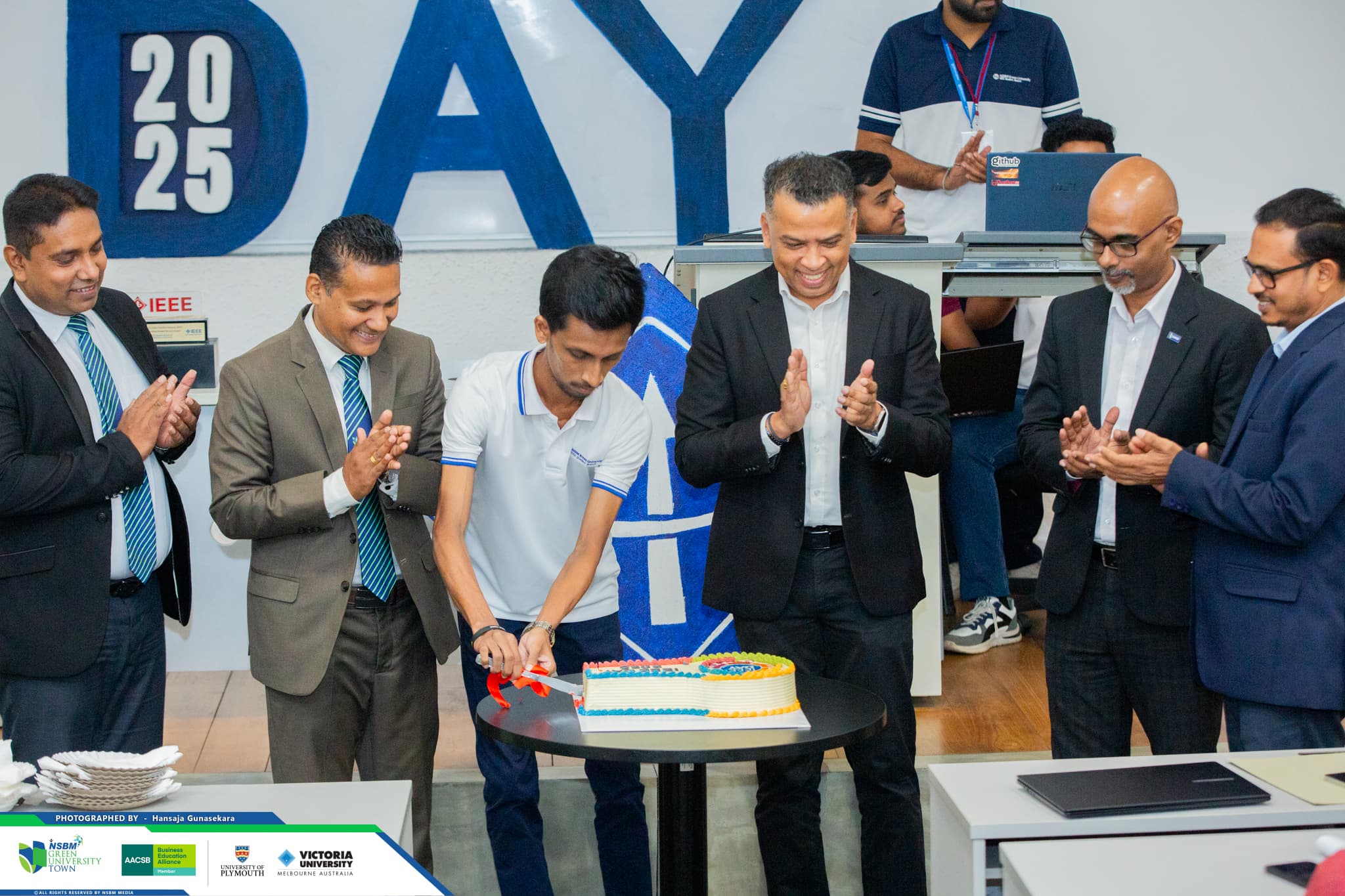 Cutting the celebration cake at IEEE Day 2025